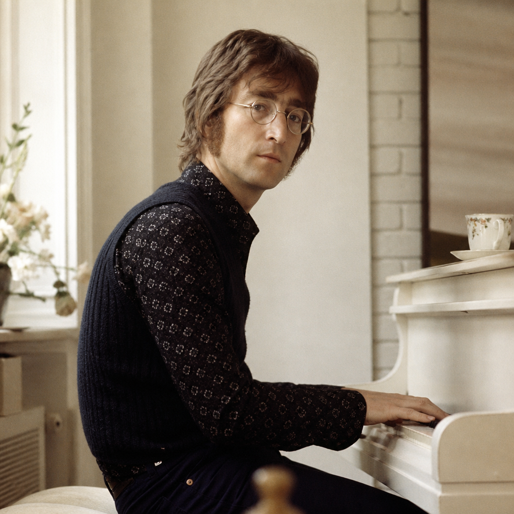 John Lennon at a piano in an early-1970s editorial portrait