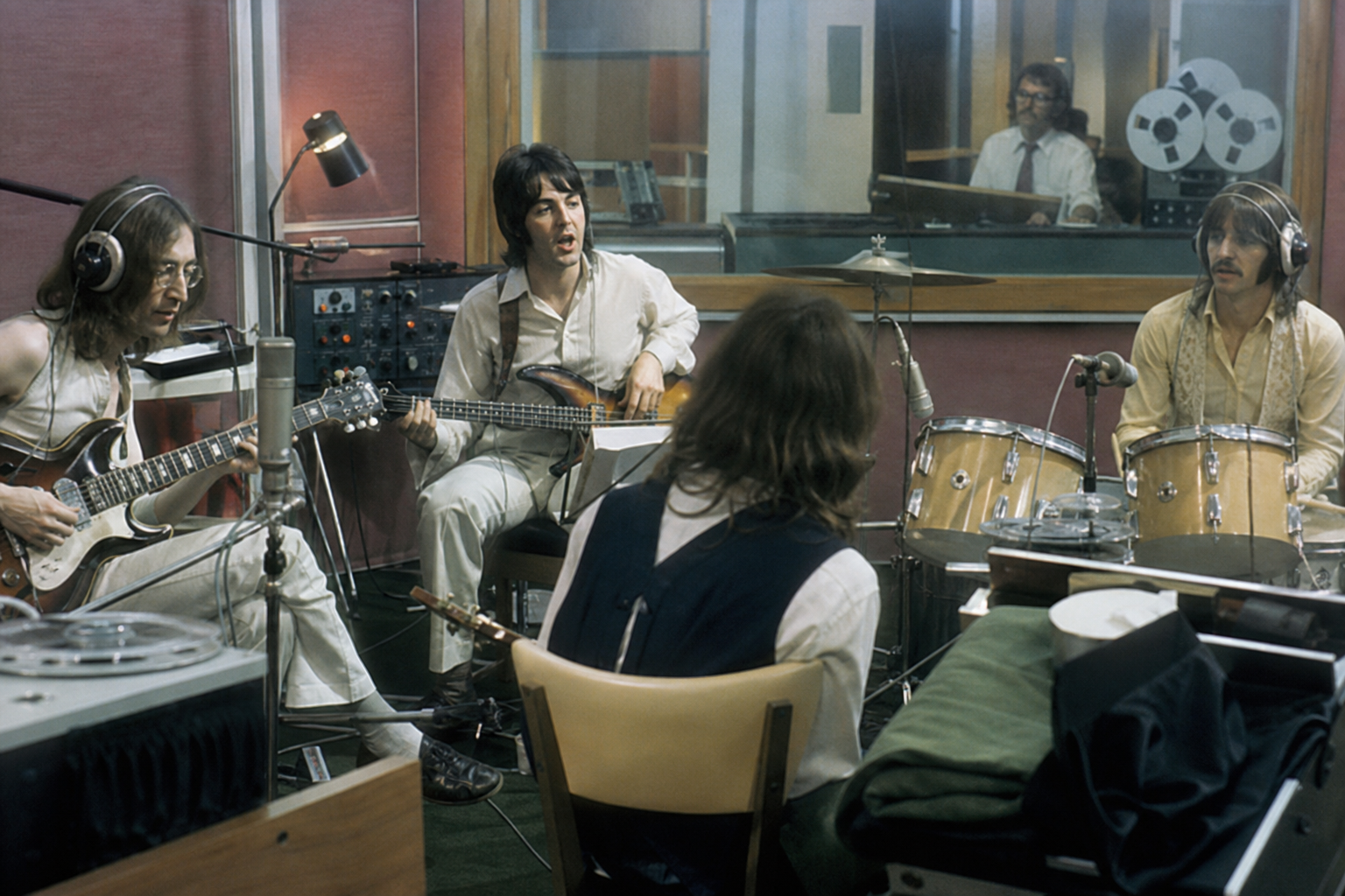Abbey Road studio session atmosphere with musicians recording live, editorial style