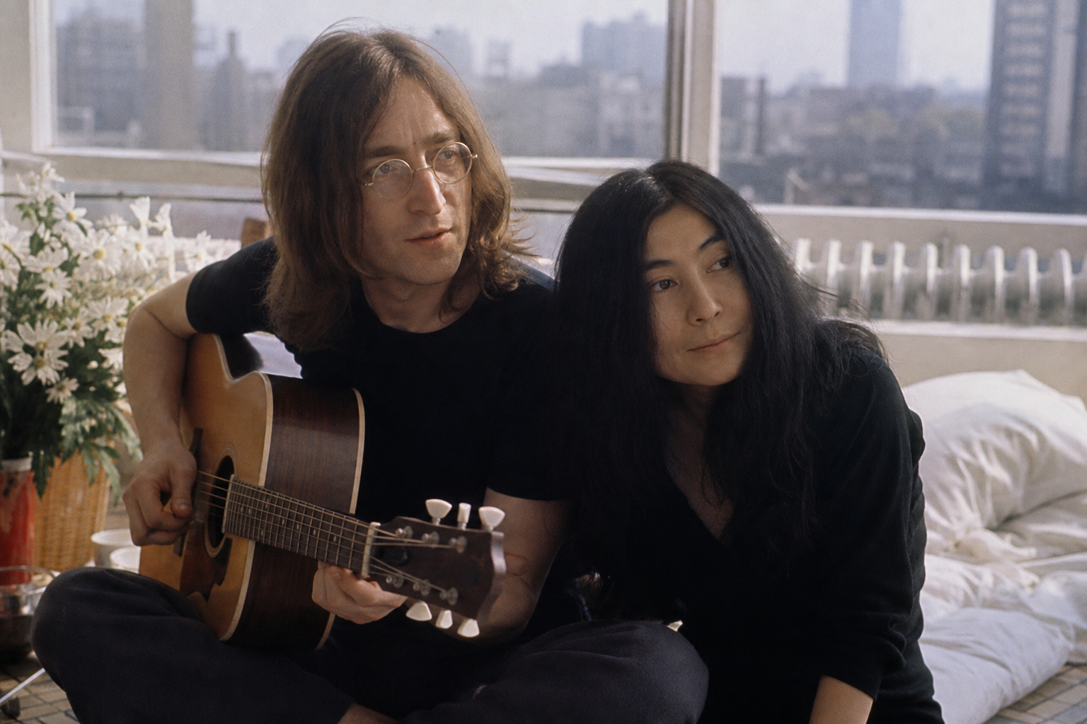 John Lennon and Yoko Ono in a creative setting, editorial style