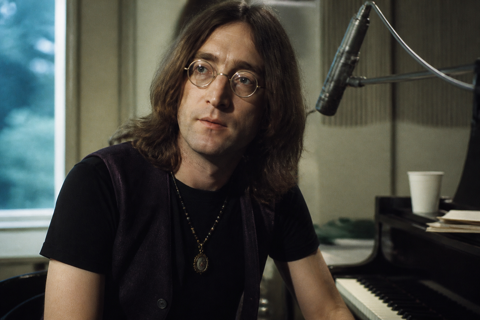 John Lennon in a reflective studio setting in the early 1970s