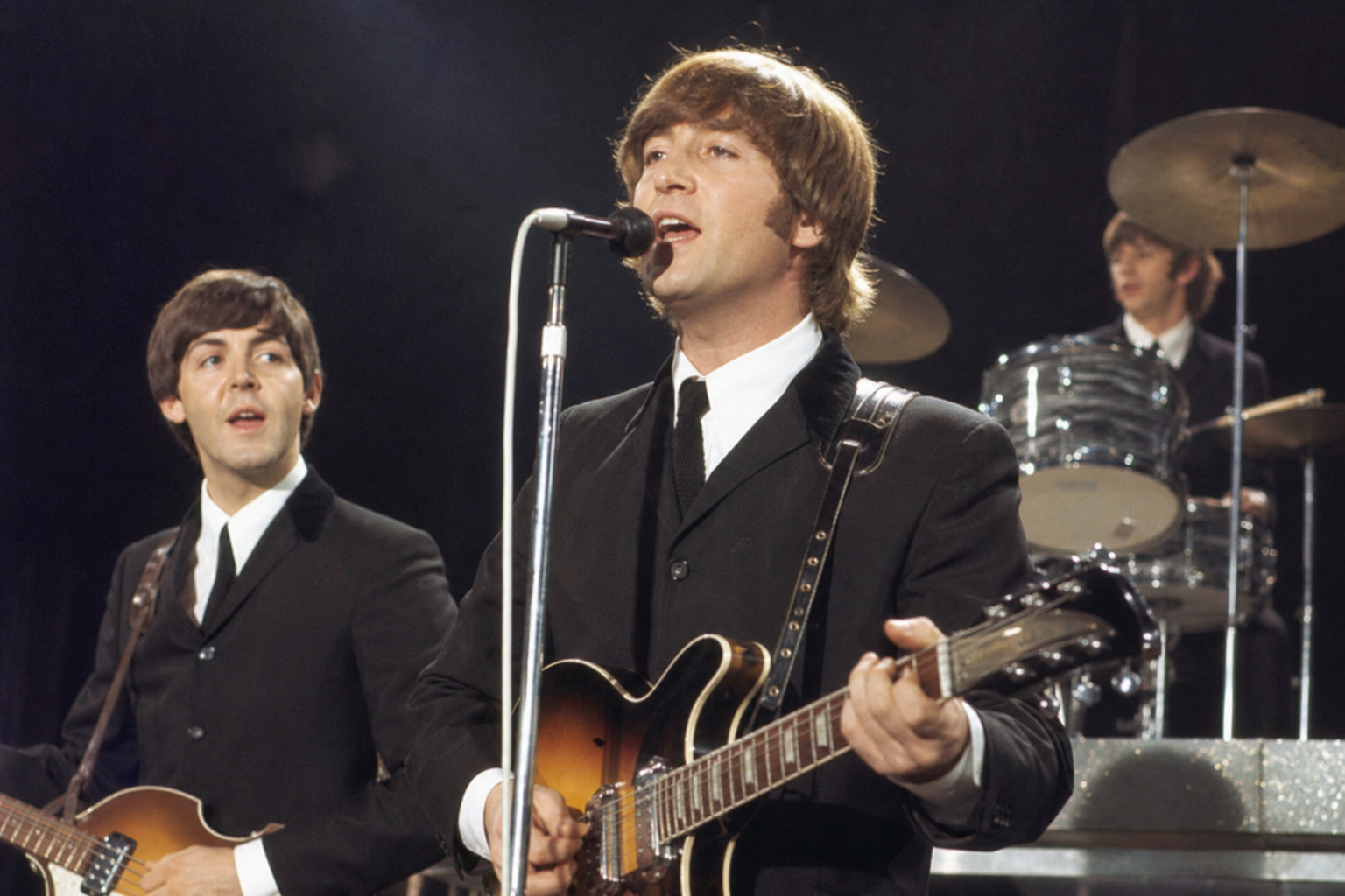 The Beatles performing in the 1960s