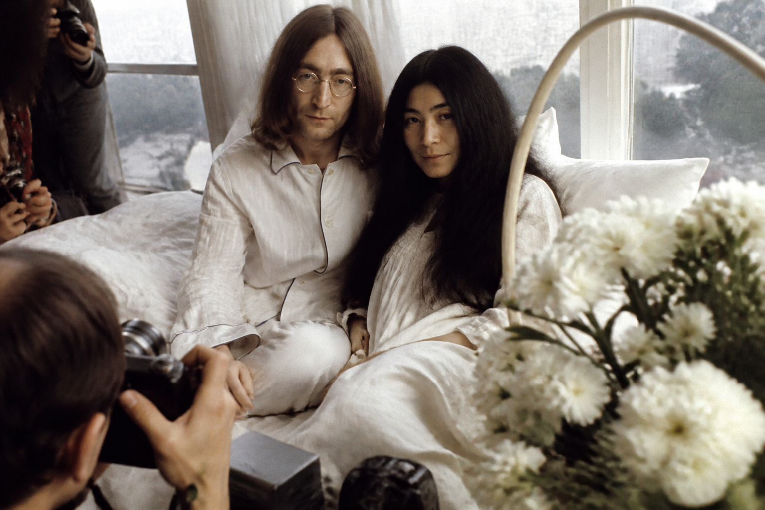 John Lennon and Yoko Ono at a peace protest setting