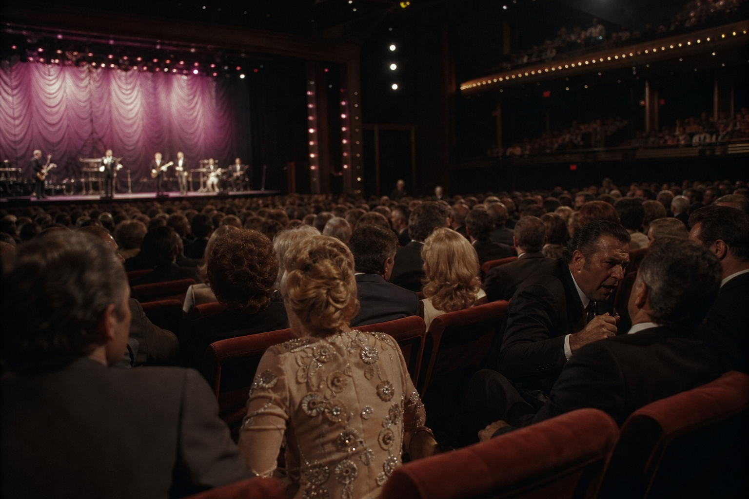 Close-up of a crowded Las Vegas audience in a dim showroom