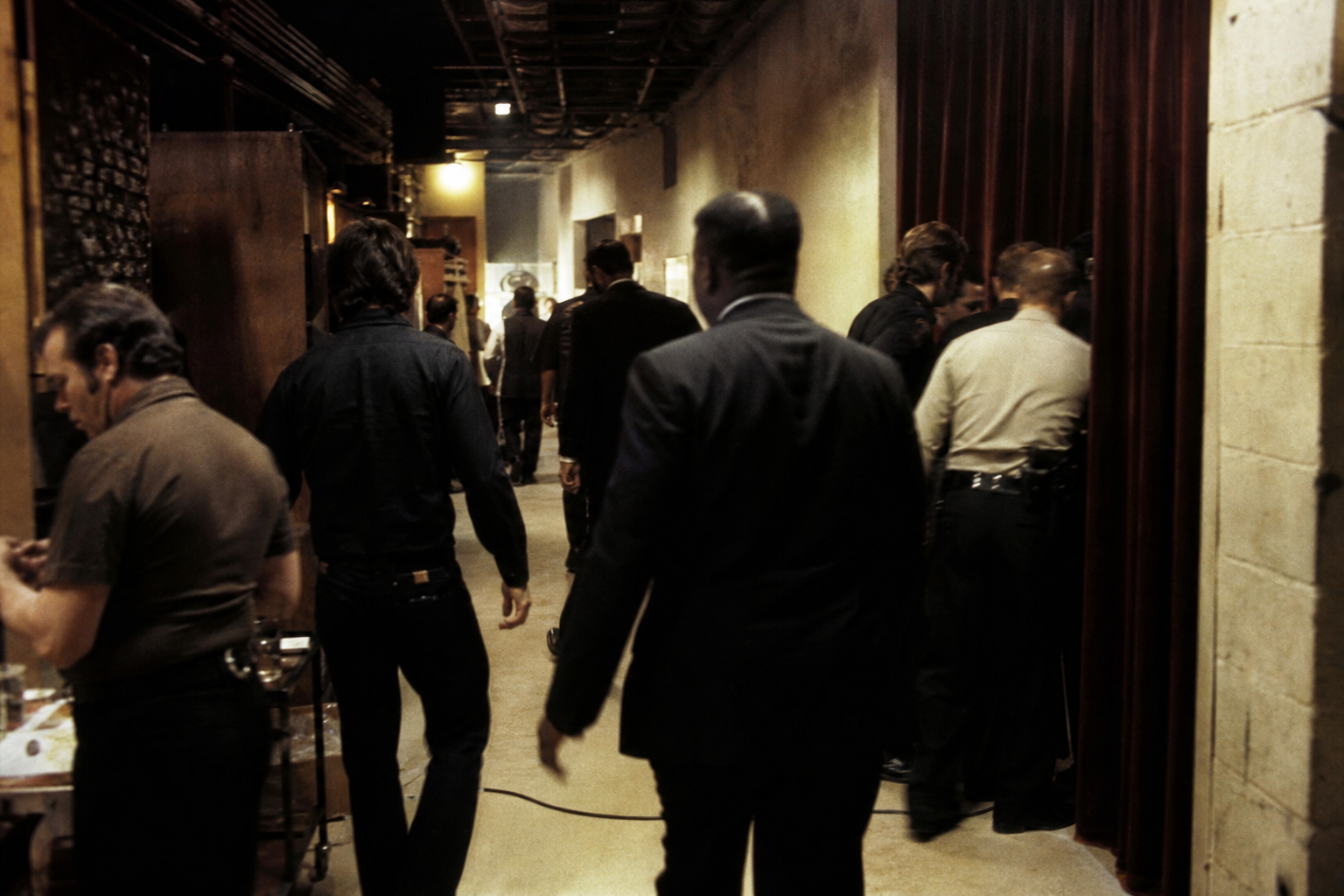 Backstage corridor at a Las Vegas theater with staff moving quickly