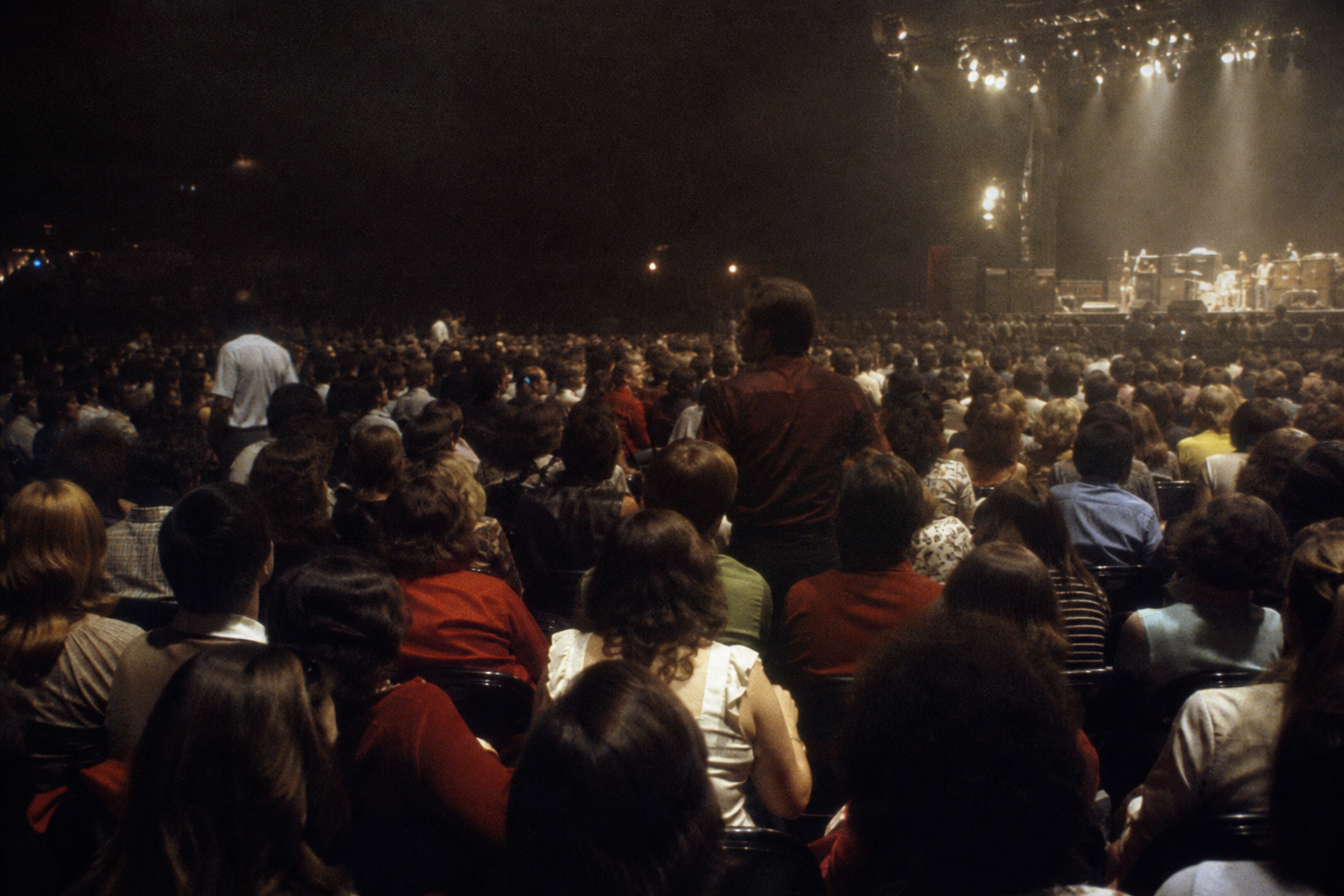 Las Vegas concert audience after a tense moment, with stage lights still on