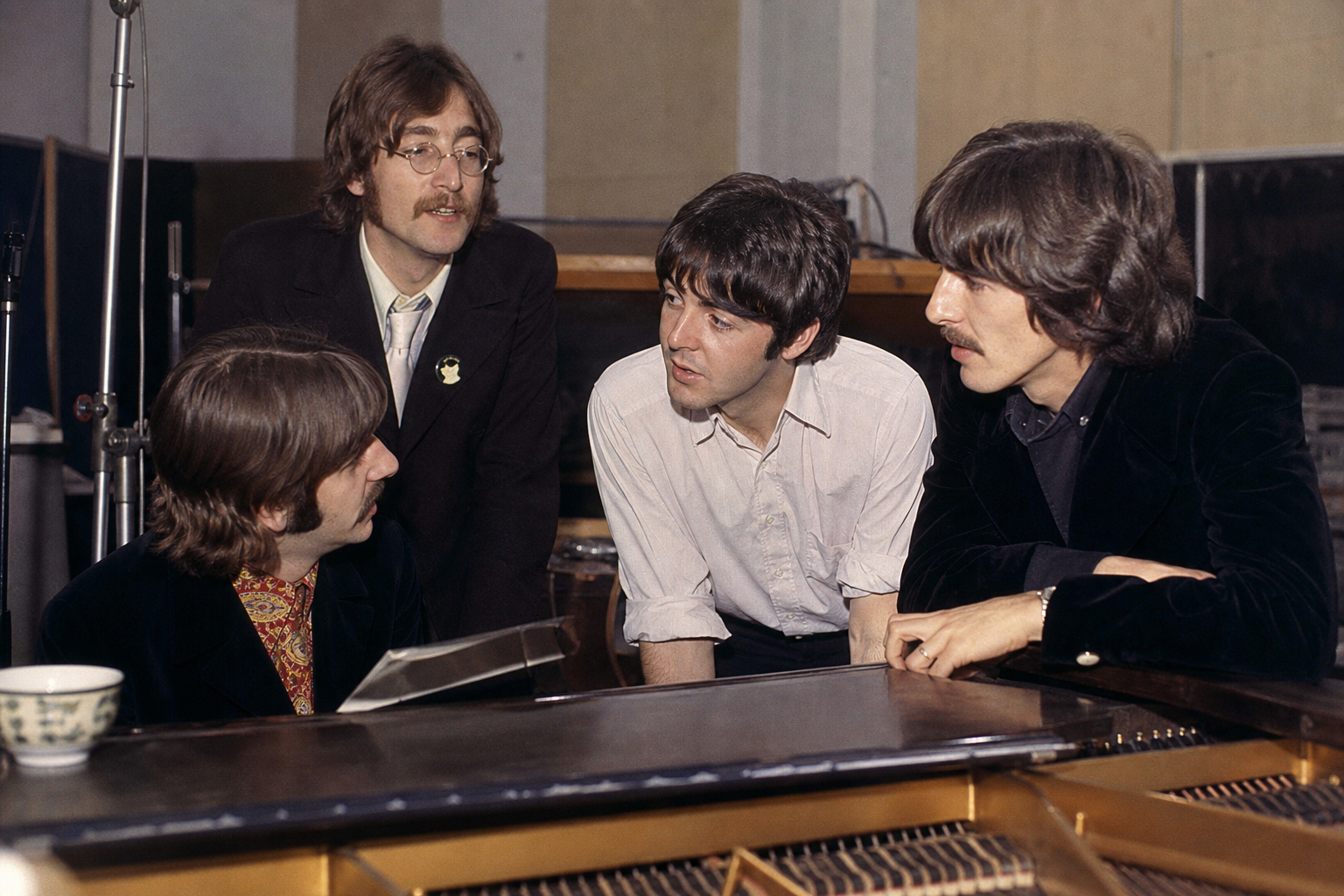 The Beatles collaborating in the recording studio