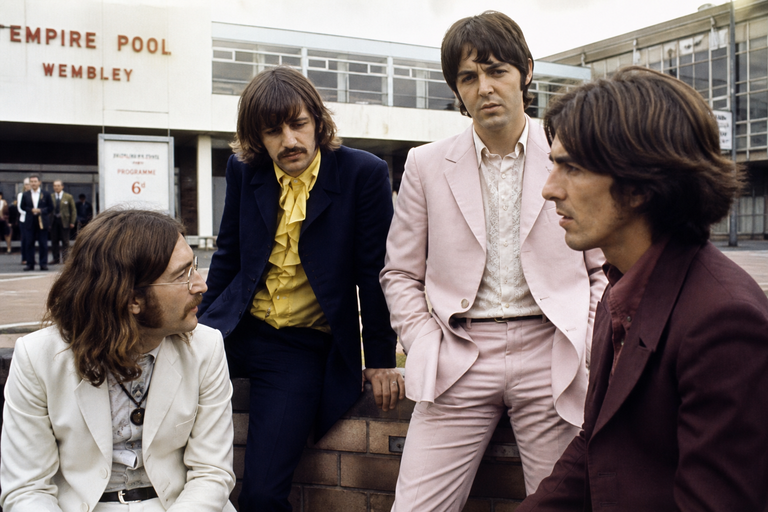 The Beatles relaxing outside a tour venue in the late 1960s