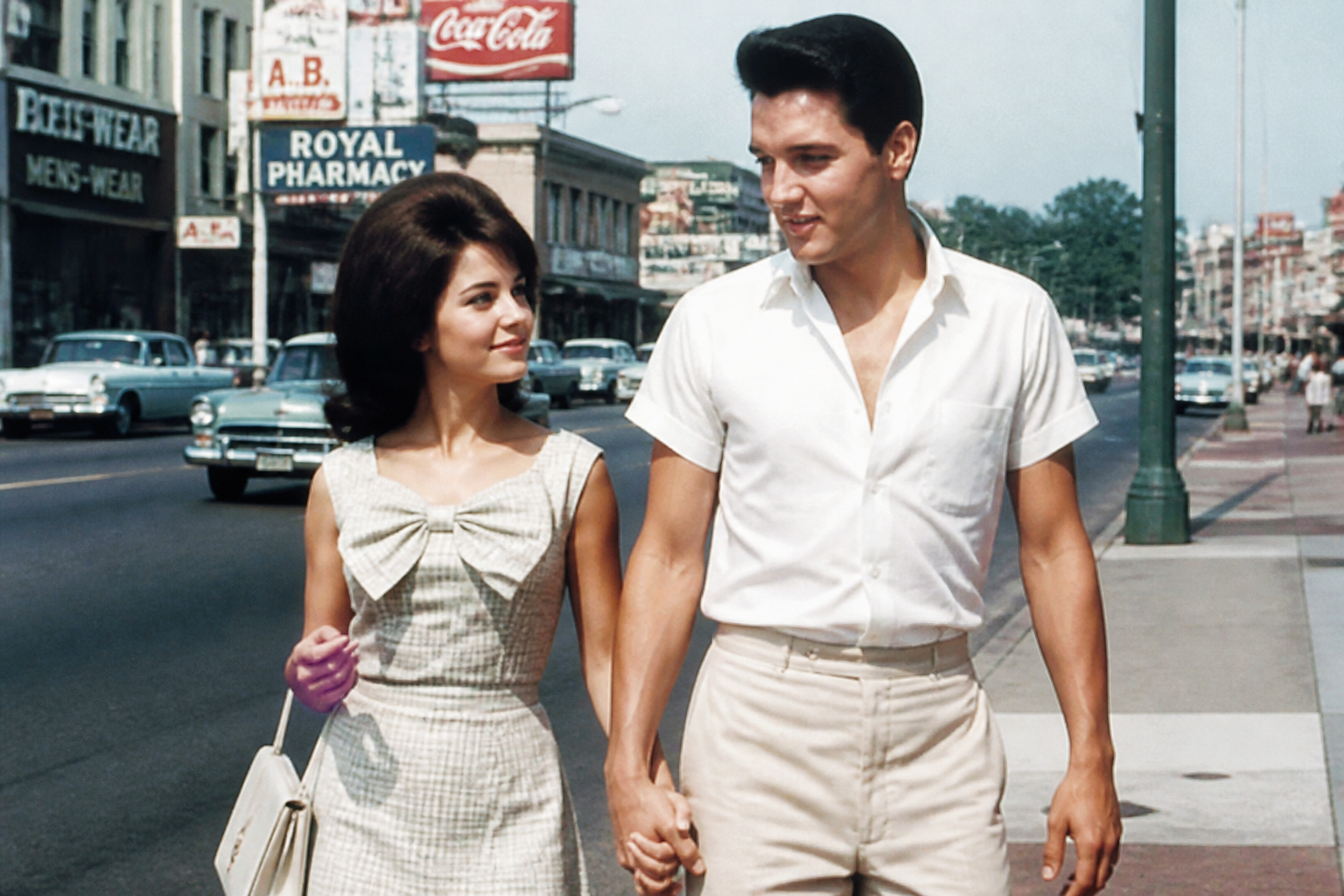 Elvis and Priscilla Presley holding hands in Memphis