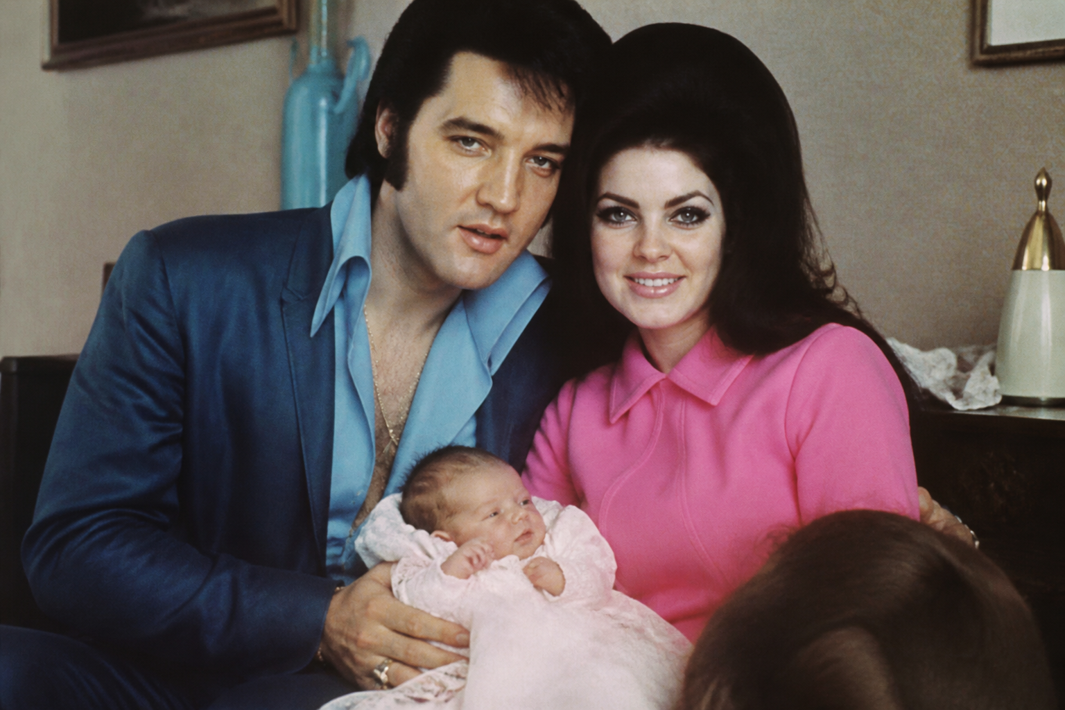 Elvis, Priscilla, and baby Lisa Marie Presley at Graceland