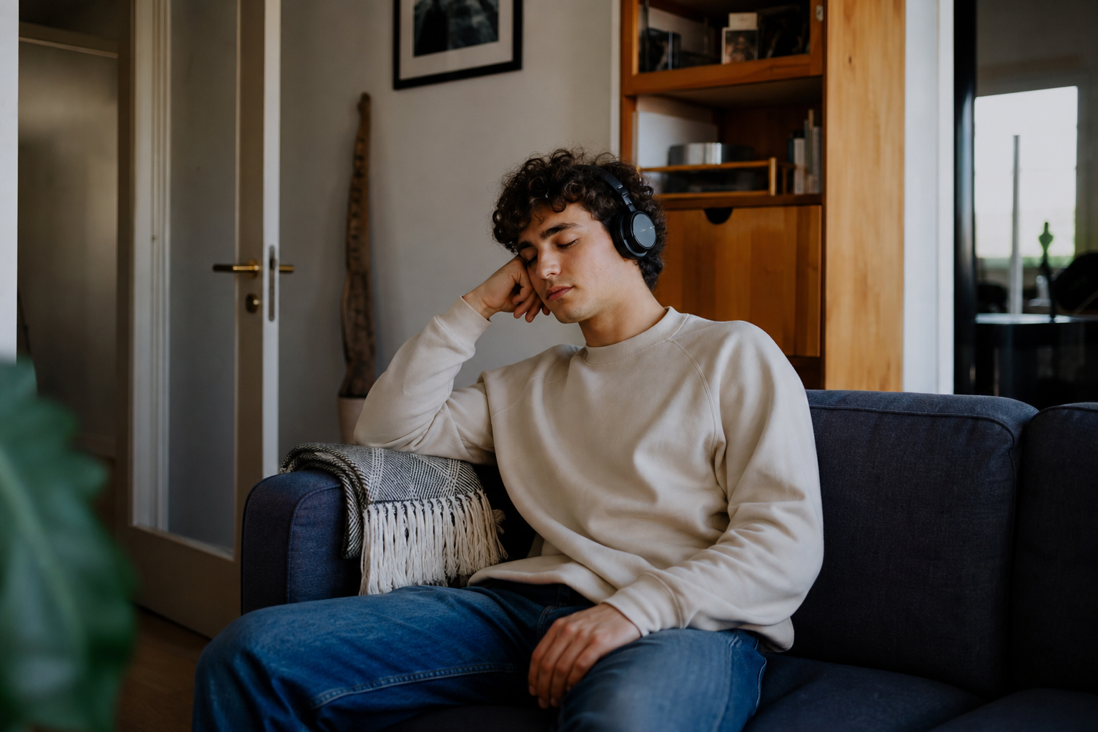 A person listening to music alone at home